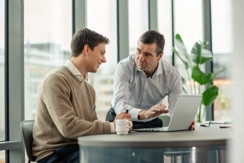 Two men working together